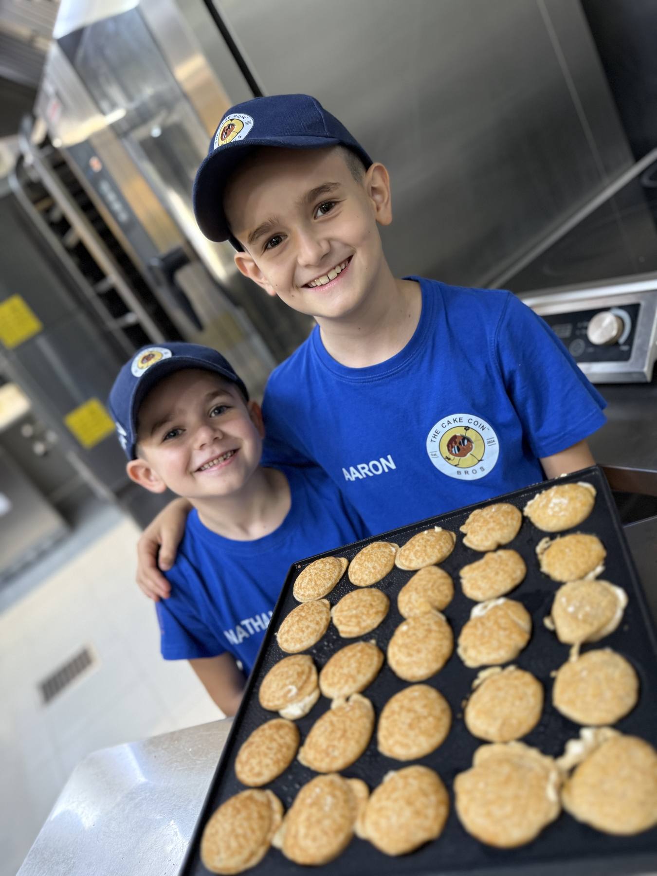 Aaron and Nathan Lederer baking allergy-friendly pancakes in the kitchen